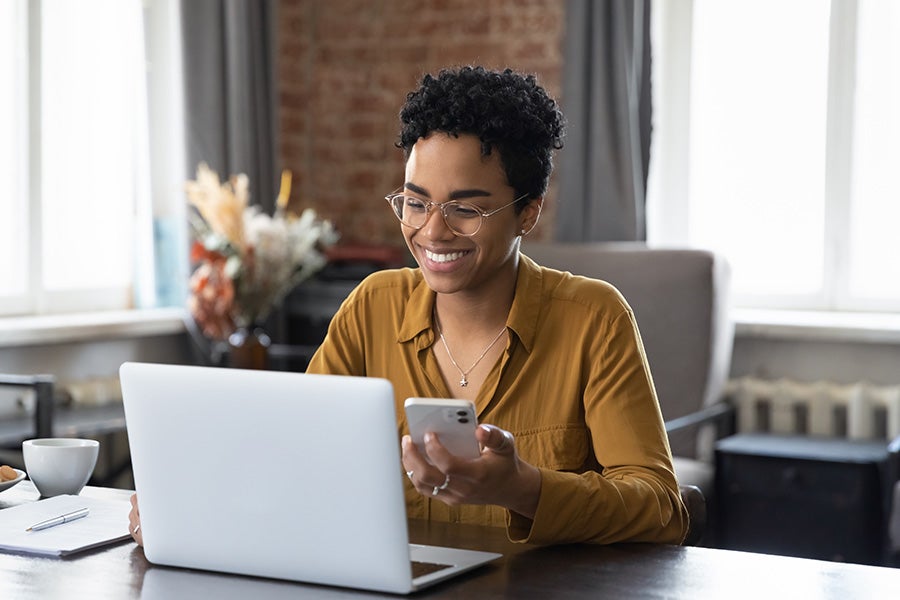 A happy women working on laptop